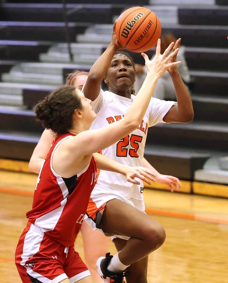 DeKalb’s Kezaria Mitchell shoots over a Hinsdale Central defender during their game Thursday, Feb. 8, 2024, at DeKalb High School.