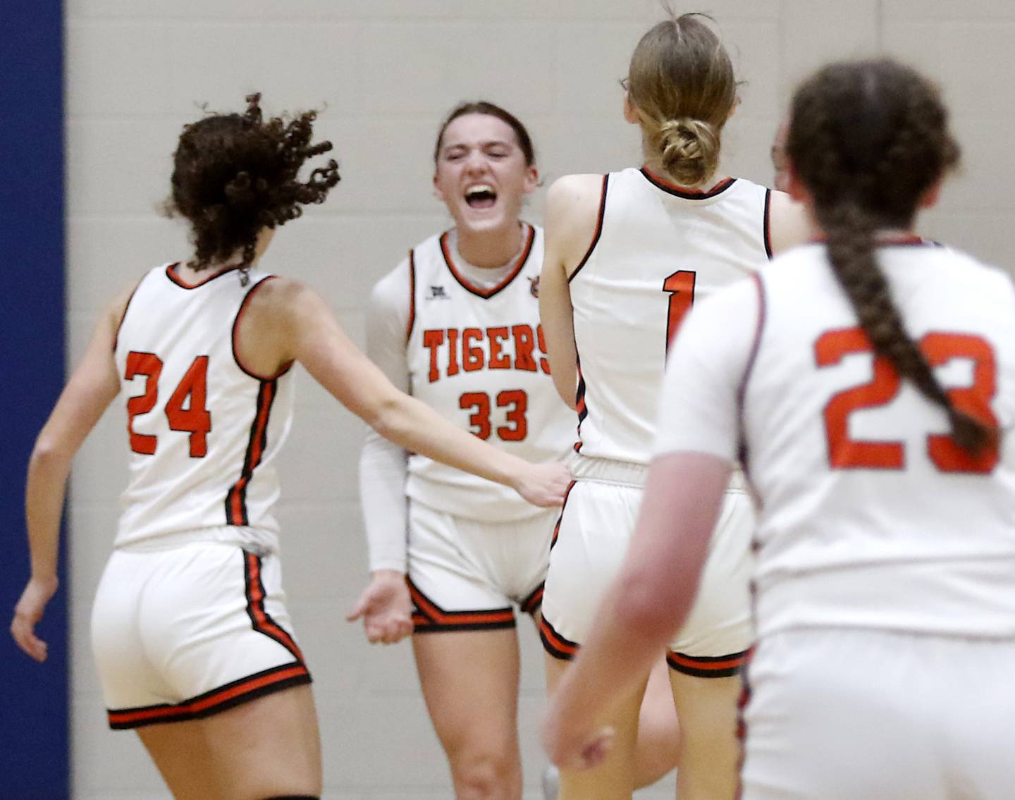 Crystal Lake Central's Katie Hamill celebrates a three-point play with her teammates during the IHSA Class 3A Woodstock Regional Championship girls basketball game against Burlington Central on Thursday, Feb. 15, 2024, at Woodstock High School.