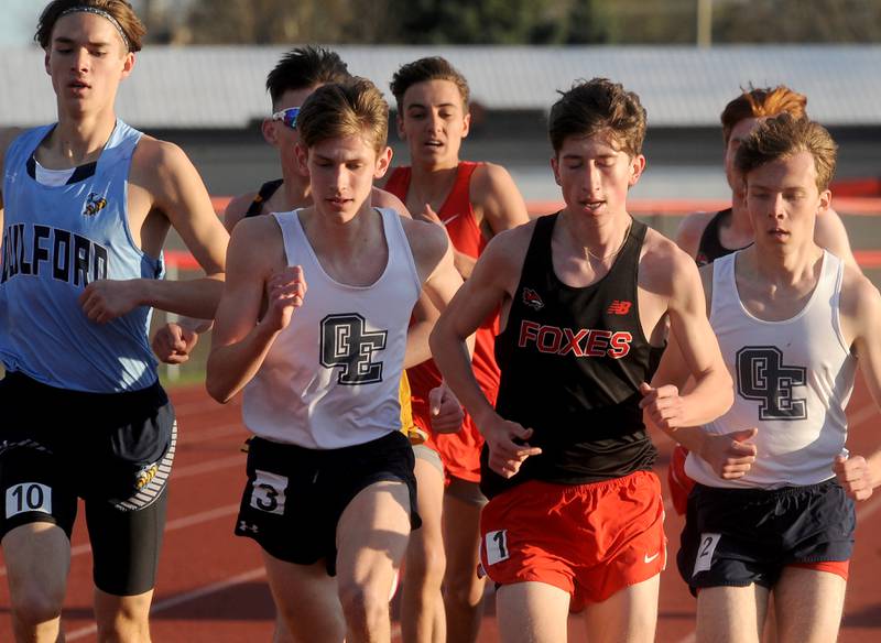 Oswego East's Eddie Bozett (3) makes a move on Yorkville's Jake Younger (1) during the Matt Wulf Track and Field Invitational at Yorkville High School on Friday, April 12, 2024.