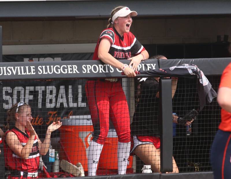 Yorkville's Myers Lily reacts while waving the teams flag from the dugout against Oak Park-River Forest during the Class 4A State semifinal softball game on Friday, June 9, 2023 at the Louisville Slugger Sports Complex in Peoria.