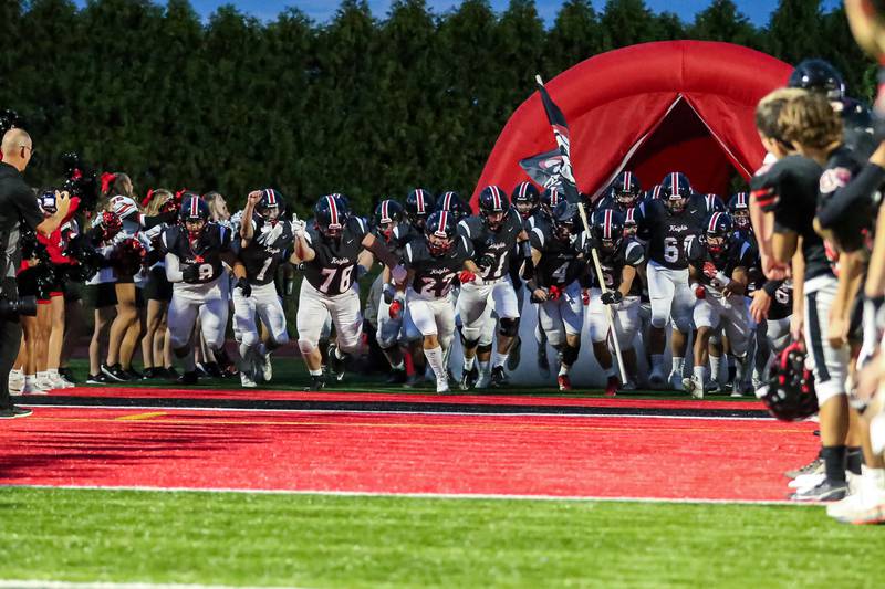 Lincoln Way Central runs onto the field before football game between Sandburg at Lincoln Way Central.  Sept 22, 2023.