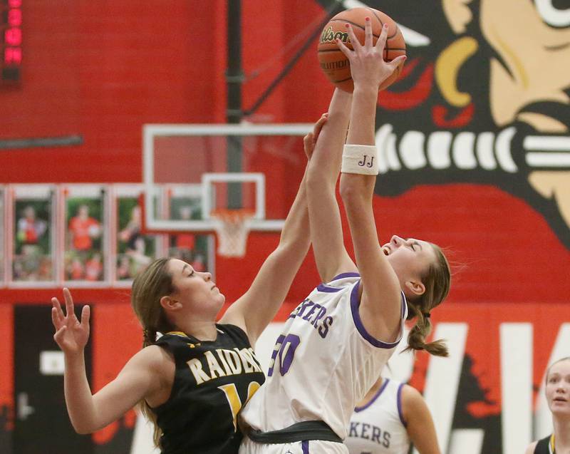 Serena's Kendall Whiteaker grabs a rebound over Ashton-Franklin Center's Claire Freeman during the Class 1A Regional final on Thursday, Feb. 15, 2024 at Earlville High School.