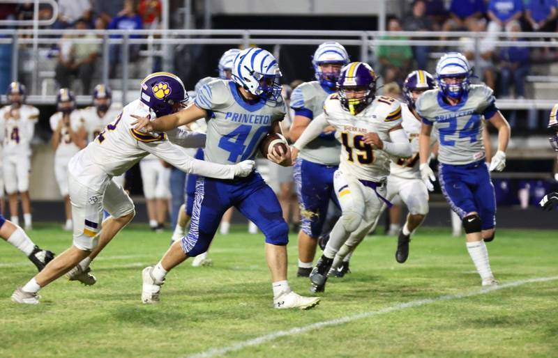 Princeton's Eli Berlins tries to shrug off Sherrard defenders in Friday's game at Bryant Field. PHS won the battle of the Tigers 59-0.