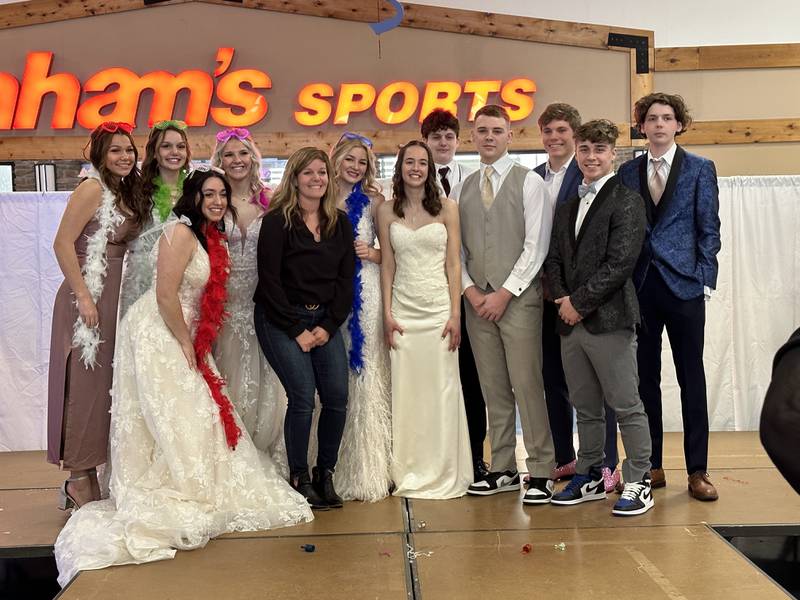 Models taking part in the Sauk Valley Bridal Fair fashion show pose with Katy Selmi (front row, second from the left) on Sunday, Feb. 5, 2023 at Northland Mall in Sterling. Back row, from left:  Makenzie Duhon, MaryKay Downs, Jaylee Dugger, Lily Willett, Tate Downs, Justin Null, Andrew Downs; front row, from left: Autry Prior, Katy Selmi, Gianna Eidola, Jason Johns, and Blake Holbrook.