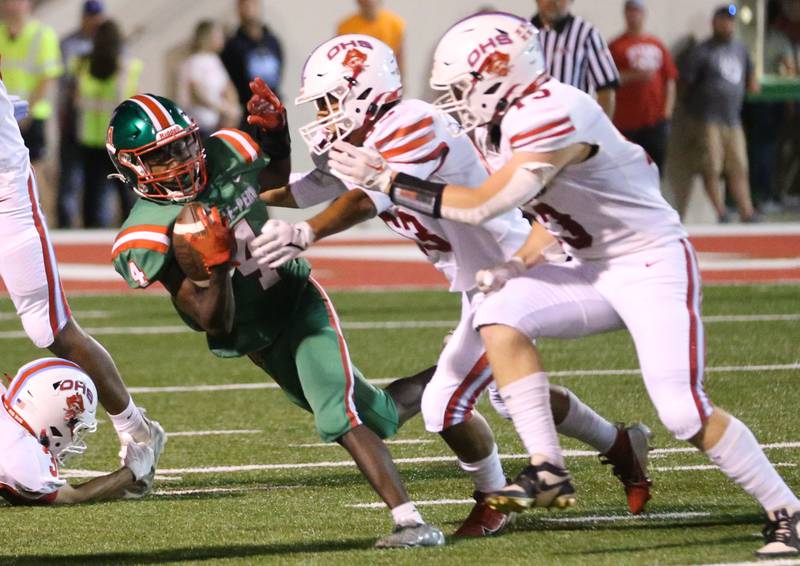 L-P's Cordell Wheatley tries to get away from a pair of Ottawa defenders on Friday, Sept. 13, 2024 at Howard Fellows Stadium.