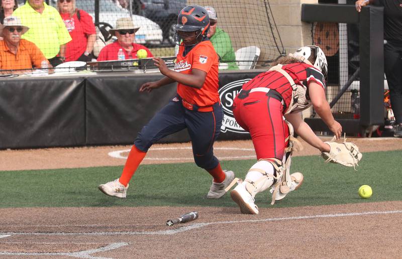 Oak Park-River Forest's Tyler Brock scores a run as Yorkville catcher Kayla Kersting drops the ball after a late throw to the plate during the Class 4A State semifinal softball game on Friday, June 9, 2023 at the Louisville Slugger Sports Complex in Peoria.