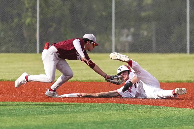 Yorkville's Aaron Klemm (22) steals second base against Plainfield North's Mateo Tristan (1) during a baseball game at Yorkville High School in Yorkville on Thursday, May 16, 2024.