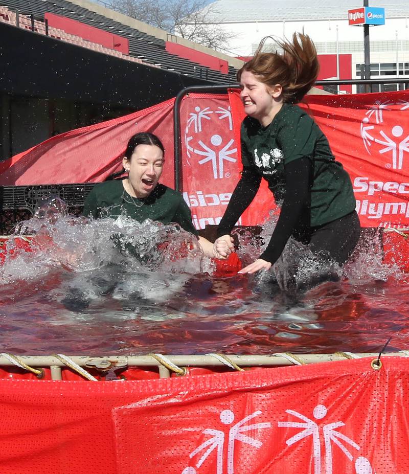 Members of the Delta Zeta sorority jump into the water on a cold and windy Saturday, Feb 17, 2024, during the Huskie Stadium Polar Plunge at Northern Illinois University in DeKalb. The Polar Plunge is the signature fundraiser for Special Olympics Illinois.