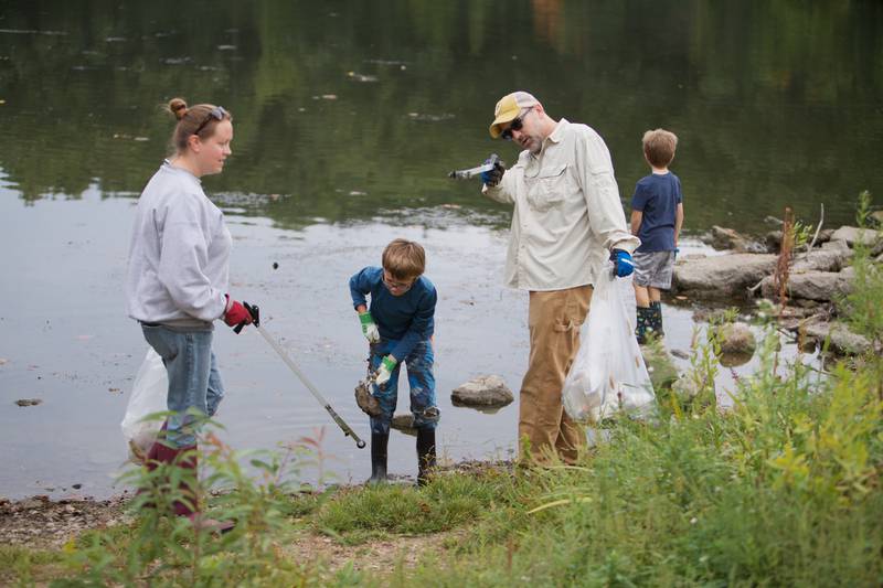 Volunteers pick up garbage during the Fox River cleanup event at Fearson Creek Park on Saturday, Sept. 16,2023 in St. Charles.