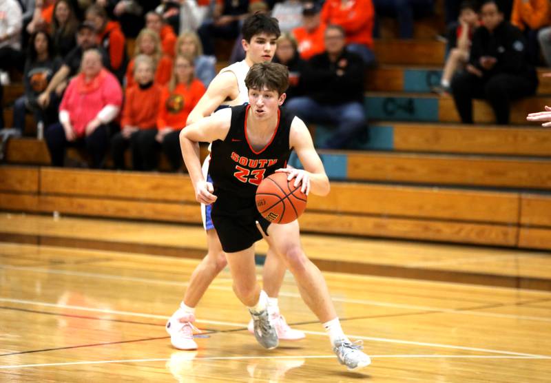 Wheaton Warrenville South’s Max O’Connell dribbles the ball during a Class 4A Willowbrook Regional semifinal game against Geneva on Wednesday, Feb. 21, 2024.