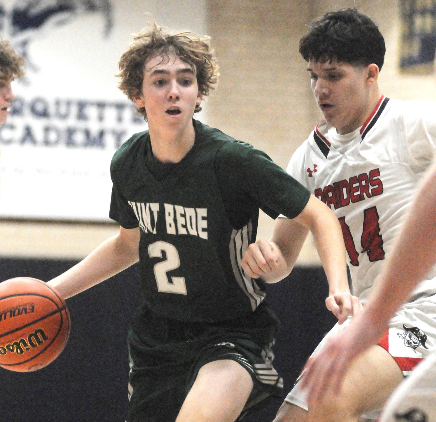 St. Bede's Kaden Nauman is guarded by Earlville's Oliver Munoz in the Marquette Holiday Tournament on Tuesday, Dec. 26, 2023.