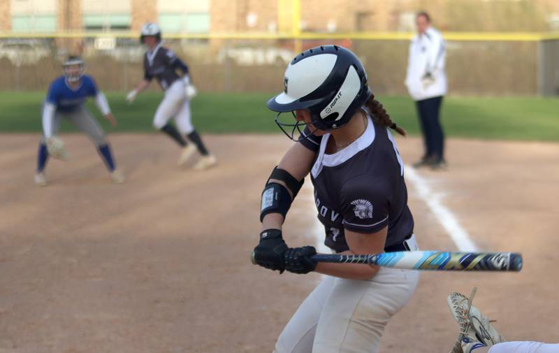 Cary-Grove’s Maddie Crick connects for a game-ending home run against Burlington Central in varsity softball at Cary Monday.