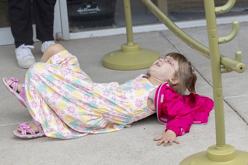 Lydia Albrecht, 6, shows off her limbo skills Saturday, June 8, 2024 at the Dixon Summer Block Party.