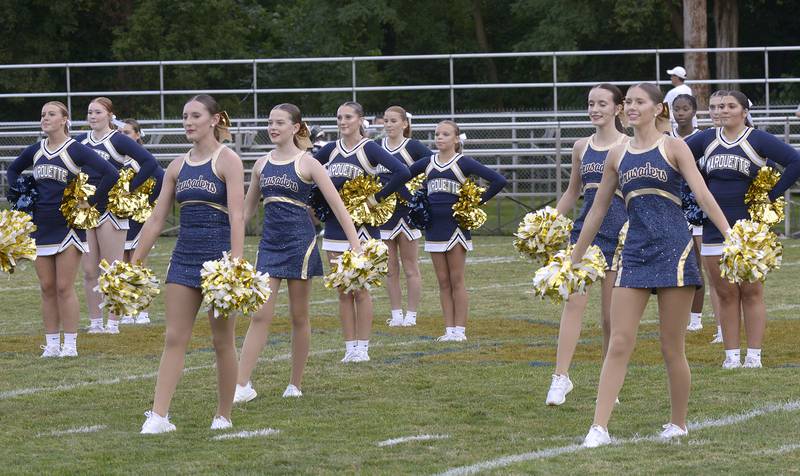 The Marquette Cheerleaders and Poms entertain prior to the Crusaders home opener Friday against Aurora Christian.