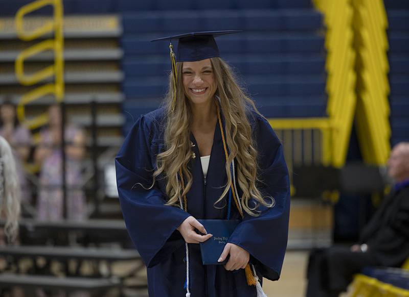 A graduating senior smiles after accepting her diploma Friday, May 24, 2024 at Sterling High School. The class of 2024 had 225 graduates for the commencement ceremony.