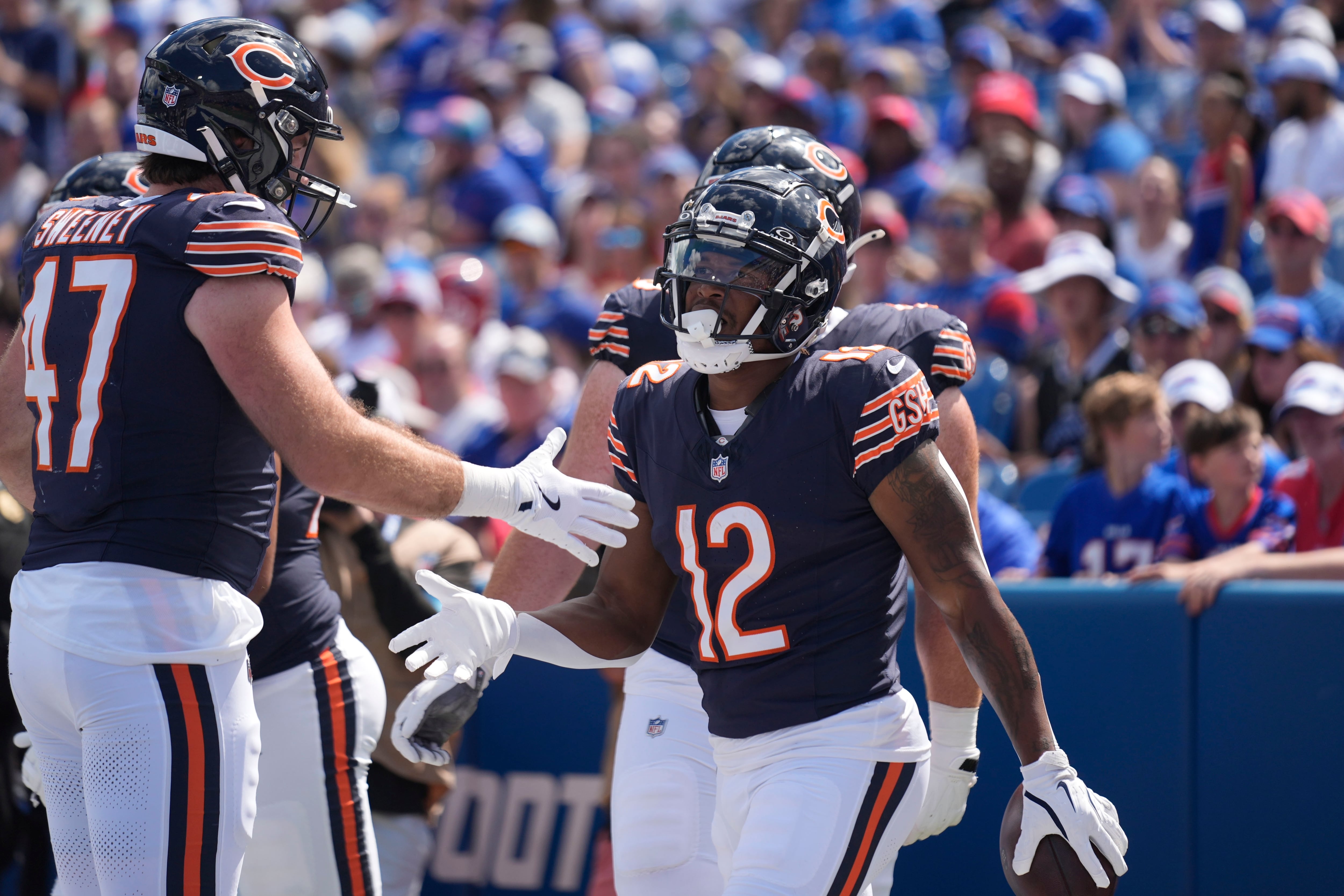 Chicago Bears wide receiver Velus Jones Jr. (12) celebrates a touchdown with Tommy Sweeney (47) during the second half of an preseason NFL football game against the Buffalo Bills in August 2024, in Orchard Park, NY.