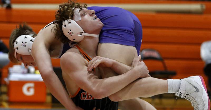 Crystal Lake Central’s Alessio Pezzella lifts Plano’s Caidan Ronning during the150x-pound championship match of a the IHSA 2A Crystal Lake Central Wrestling Regional on Saturday, Feb. 3, 2024, at Crystal Lake Central High School.