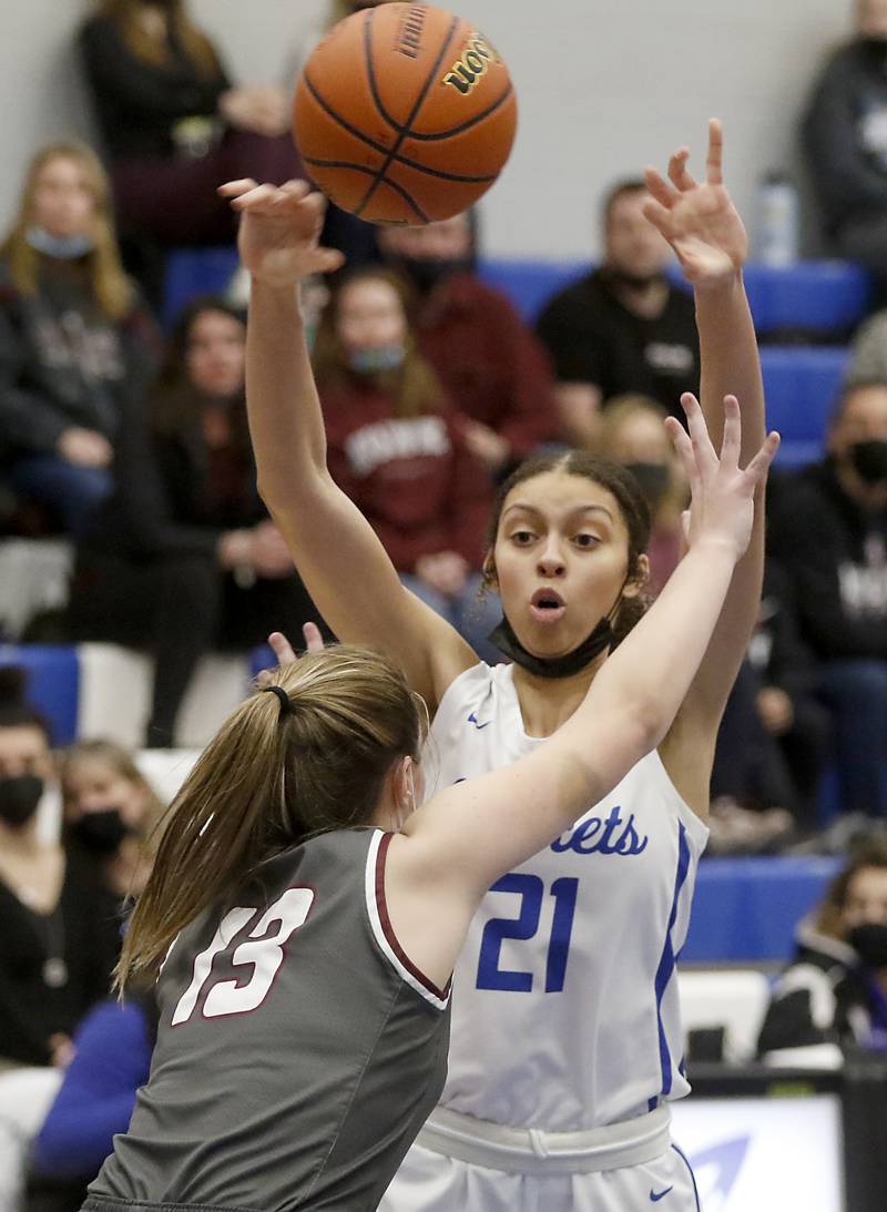 Burlington Central's Taylor Charles passes the ball while being defended by Prairie Ridge's Abigail Kay during Fox Valley Conference girls basketball game Monday evening, Jan. 31 2022, between Prairie Ridge and Burlington Central at Burlington Central High School.