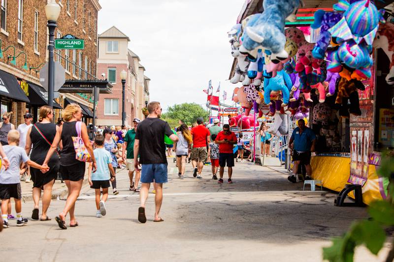 Festival goers walk downtown Downer’s Grove during the town’s  Rotary Fest, Saturday, June 22, 2024.

Suzanne Tennant/For Shaw Local News Media