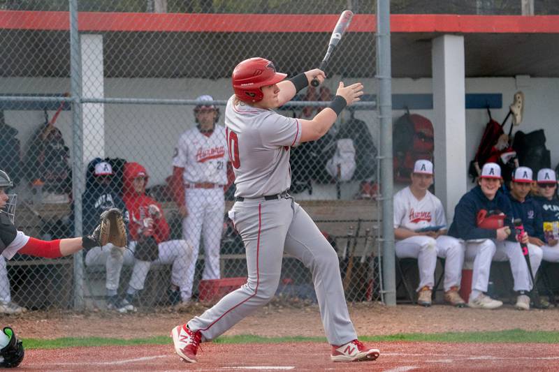 Yorkville's Michael Dopart (10) singles driving in a run against West Aurora during a baseball game at West Aurora High School on Monday, April 24, 2023.