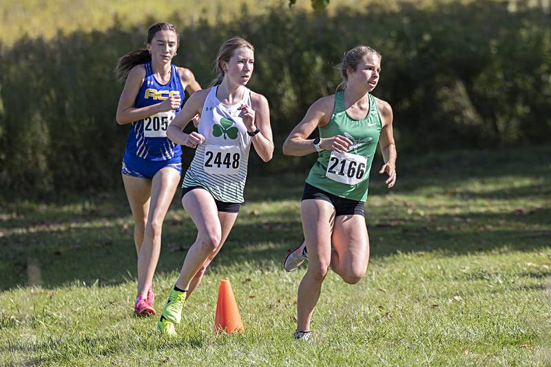 Eureka’s Meika Bender (right), Senec’s Evelyn O’Connor and Aurora Central Catholic’s Cecilia Hilby took first through third in the 50th Amboy Columbus Day Cross Country Invite Monday, Oct. 9, 2023.