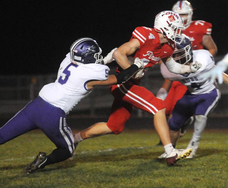 Rochelle's Elijah Harley (5) and Gavin Neale tackle Ottawa's Weston Averkamp at King Field on Friday, Oct. 18, 2024.