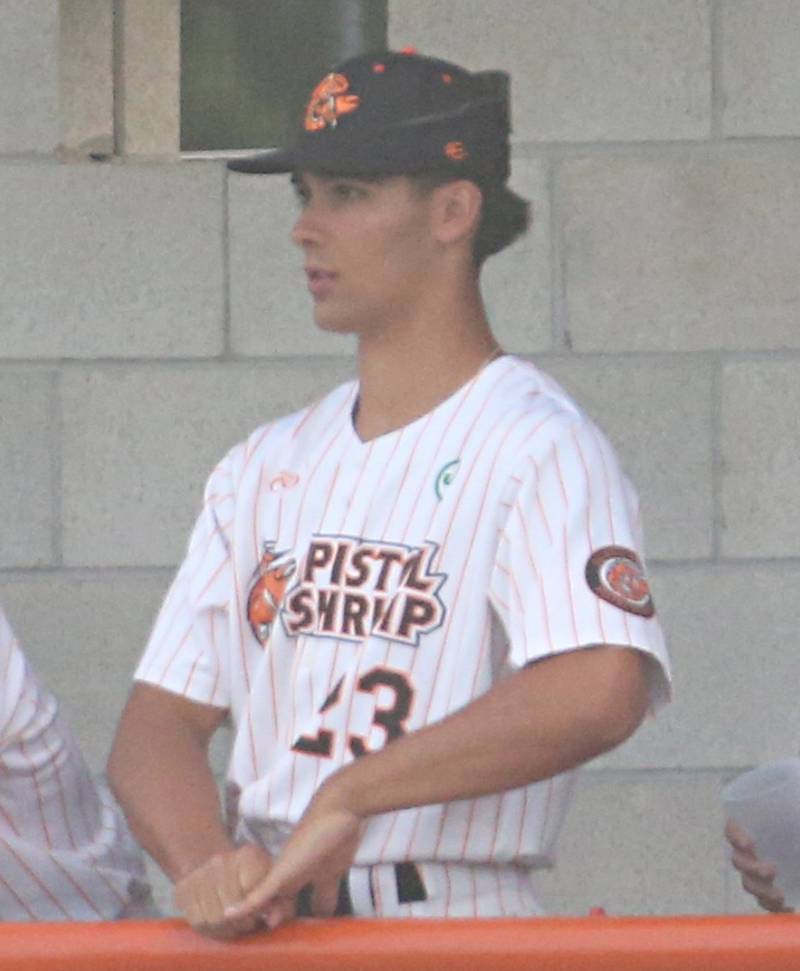 Marquette graduate and former standout pitcher Taylor Waldron stands in the Pistol Shrimp dugout during the home opener in Schweickert Stadium in late May at Veterans Park in Peru.