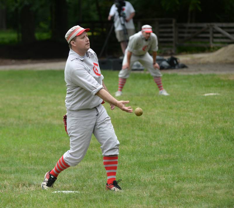 Oregon Ganymede Aaron "Two Bits" Berg pitches agains the DuPage Plowboy during a vintage base ball game at the John Deere Historic Site in Grand Detour on Saturday, June 8, 2024.