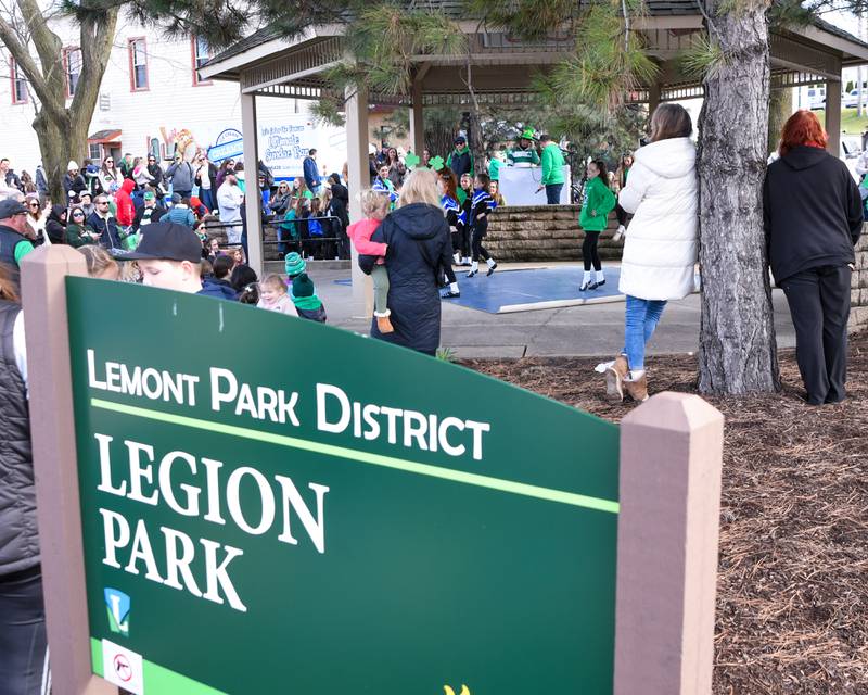 Community members watches Bailey Murray academy of Irish dancing at the Legion Park during the St. Patrick’s festivities on Saturday March 9, 2024, in downtown Lemont.