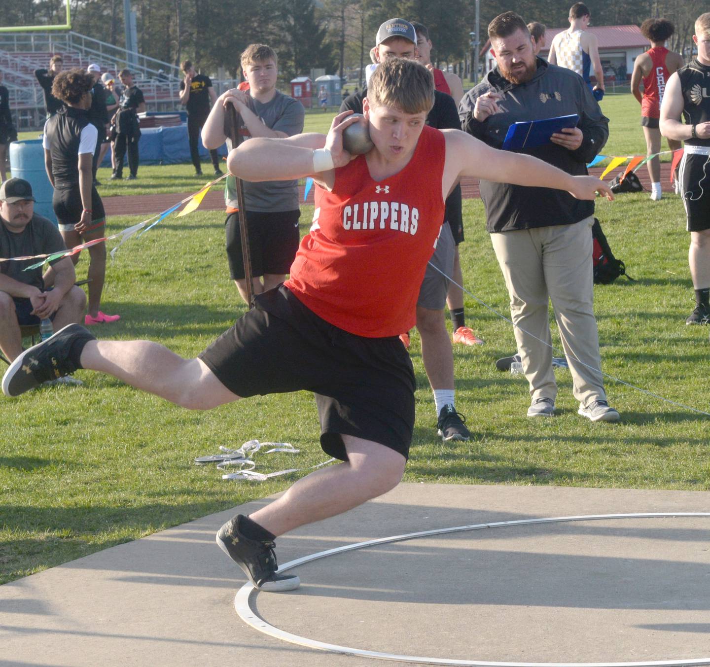 Amboy's Ian Sundberg uses every inch of the shot put circle as he throws at the Hawk Classic in Oregon on Friday, April 28.