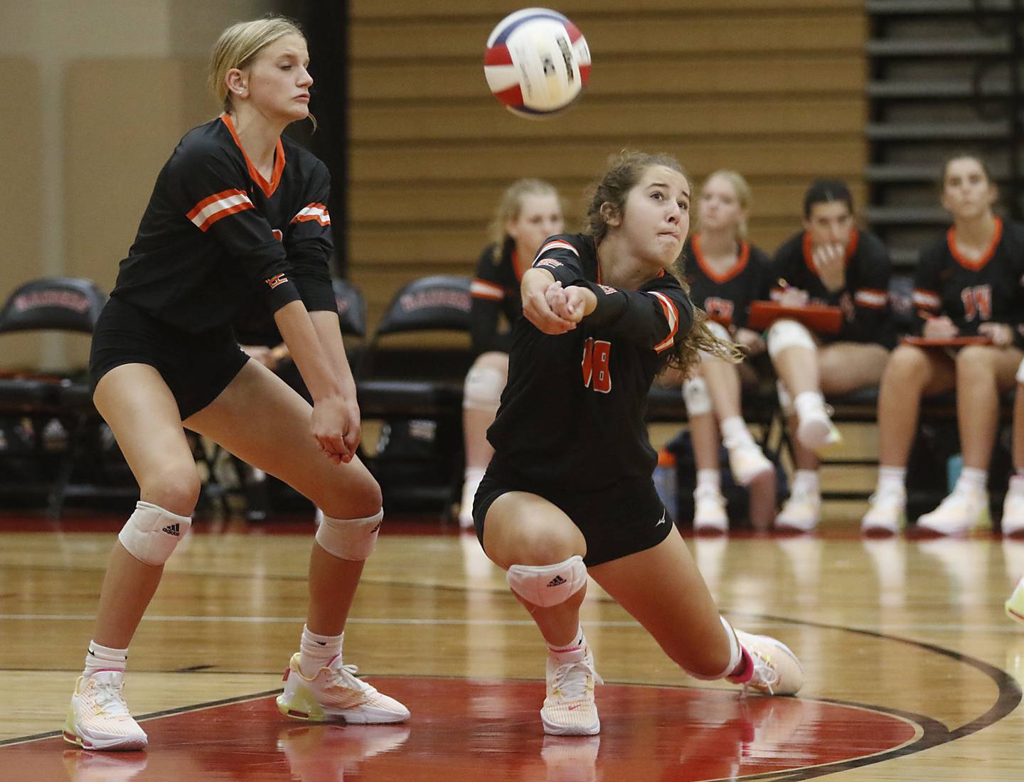 Crystal Lake Central’s Anna Starr tries to dig the ball in front of her teammate, Alexis Hadeler, during a Fox Valley Conference volleyball match against Huntley Tuesday, Aug. 22, 2023, at Huntley High School.