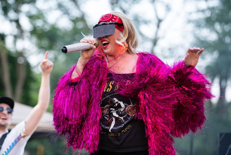 Hello Weekend singer Christina performs during North Aurora's annual Independence Day celebration at Riverfront Park in North Aurora on Monday, July 3, 2023.