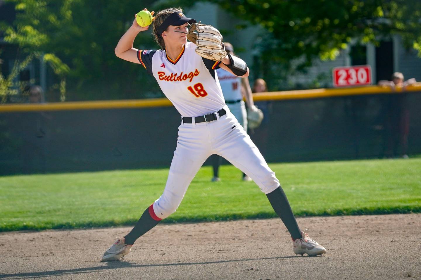 Batavia’s Gwen Shouse (18) fields a grounder and throws to first for an out against Batavia during a softball game at Batavia High School on Wednesday, May 8, 2024.
