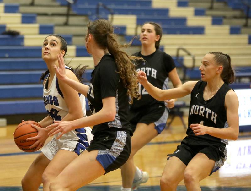 Geneva’s Leah Palmer looks for an opening from under the basket during a game against St. Charles North at Geneva on Tuesday, Feb. 6, 2024.