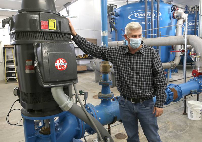 Matt Anderson, Sycamore Public Works director, points out where the hole is drilled to the actual well Friday, Dec. 3, 2021, at well 10, tower two on Main Street.