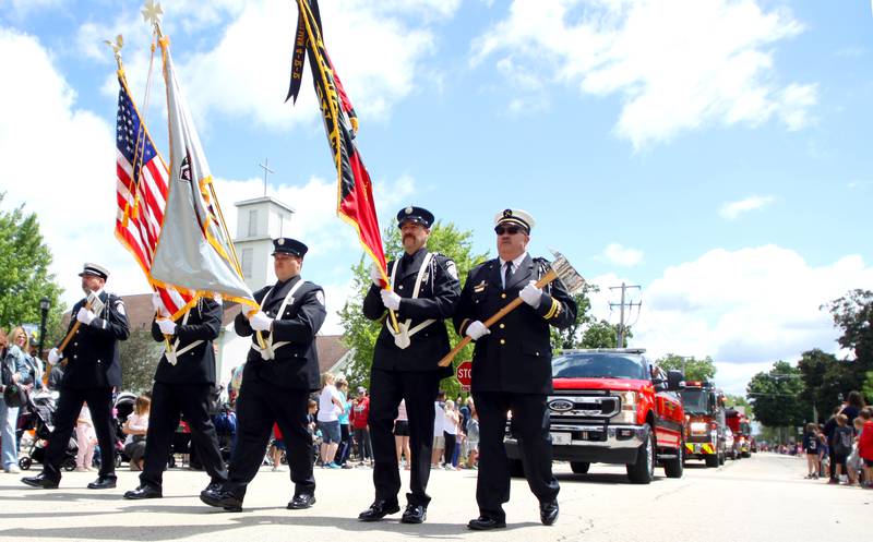 Huntley Fire Protection District members march as part of the Huntley Memorial Day parade and observance Monday.