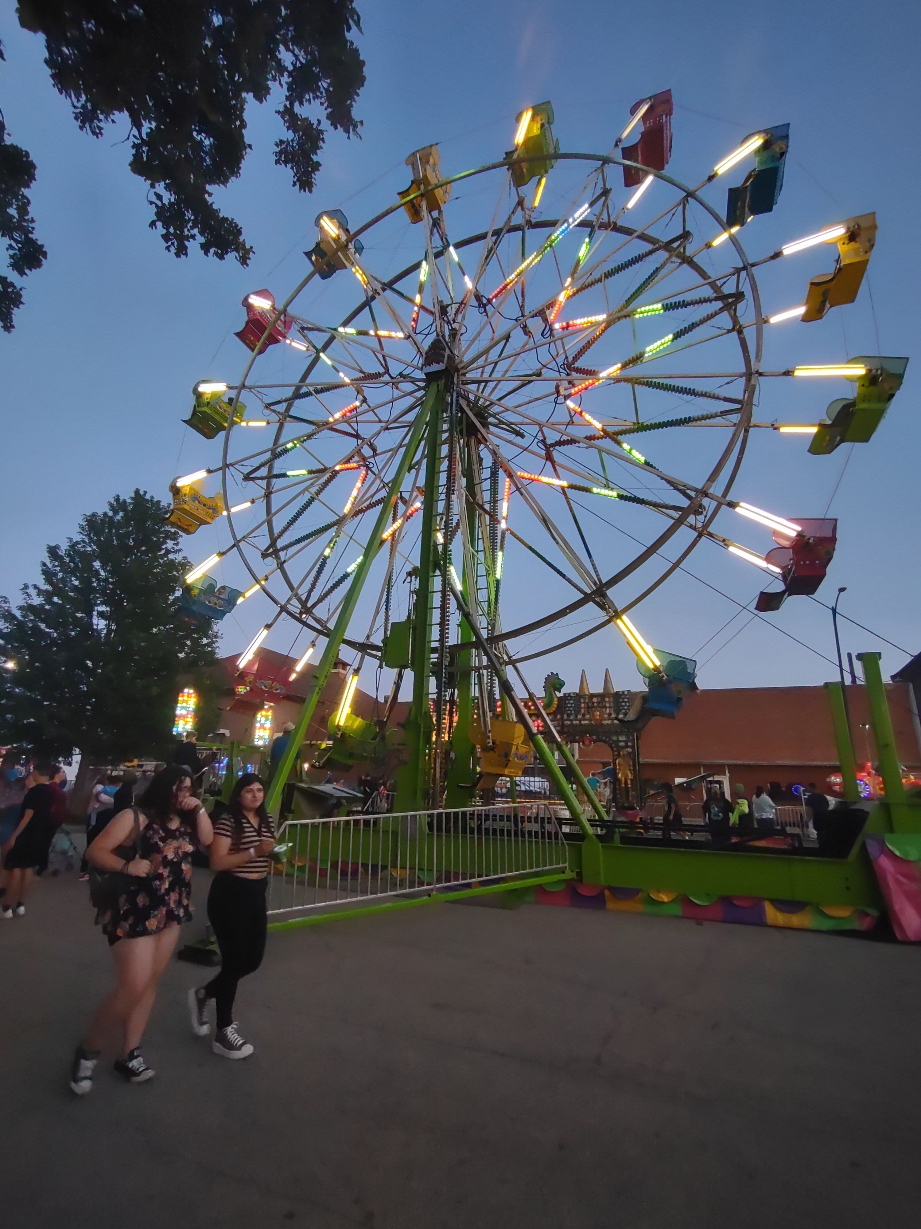 Carnivalgoers stroll the midway on Hickory Street during the opening night of Park Fest on Friday, May 26, 2023, in downtown Streator.