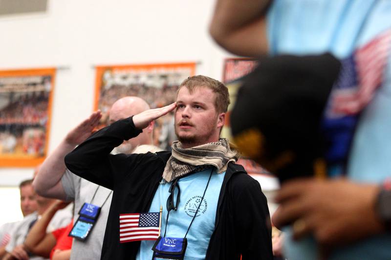 Veterans salute the flag as McHenry Community High School hosted a celebration Sunday for veterans returning from an Honor Flight trip to Washington D.C. The Honor Flight trip was coordinated by the Veterans Network Committee of Northern Illinois.