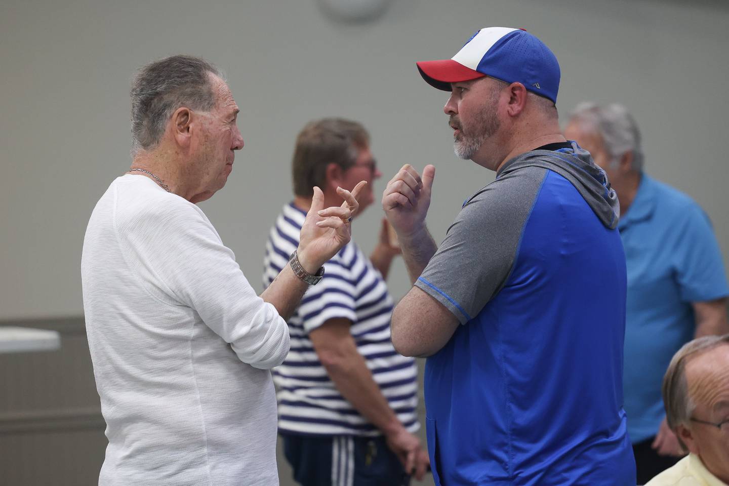Old Timers Baseball Association of Will County board member Jim Greenan talks with Mike Paone, of the St. Joe’s 12U travel team. The baseball association handed out $20,500 to local baseball and softball program during their quartly meeting on Monday, April 15, 2024 in Joliet.