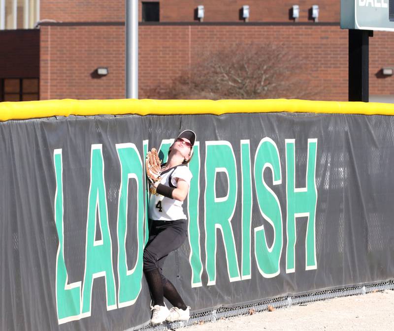 Putnam County's Sarah Johnson runs all the way to the wall as she watches Seneca's Sam Vandevelde's home run soar over the fence on Thursday, April 13, 2023 at Seneca High School.