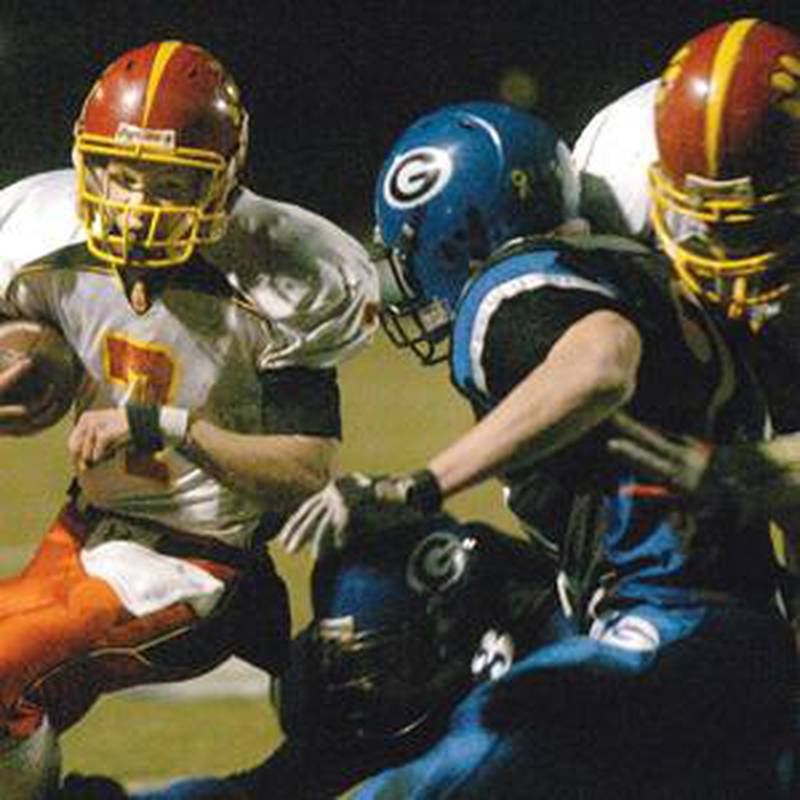 Batavia's Alex Schroeder, left, runs against Geneva in Saturday's game at Geneva High School. (Bob Gerrard photo)