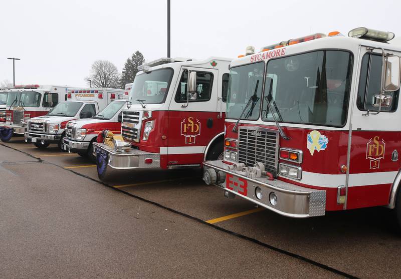 Fire department apparatus fill the parking lot at the Sycamore Park District Community Center Saturday, Jan. 6, 2024, at the visitation for Sycamore firefighter/paramedic Bradley Belanger. Belanger, 45, who worked with the Sycamore Fire Department for more than two decades, died Friday, Dec. 22, after a yearlong battle with cancer.