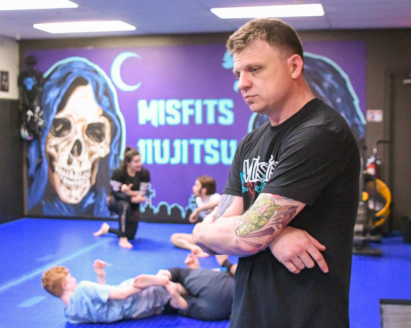 Brad Edmondson the owner and operator of The Misfits Jiujitsu watches class in St. Charles on Wednesday March 3, 2024.