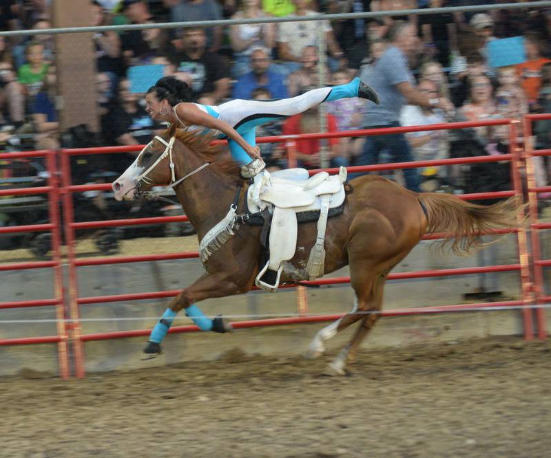 Stunt rider Dusty Crane Dickerson rides performs during the Big Hat Rodeo at the Ogle County Fair on Friday, Aug. 4, 2023.