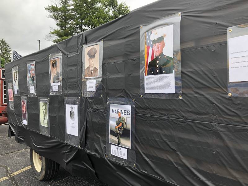 Photographs of servicemembers on a float before the Johnsburg Memorial Day parade Monday May 27, 2024.
