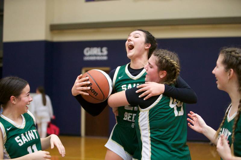 St. Bede's Ali Bosnich celebrates scoring 1,000 points and is hugged by Savannah Bray at the Class 1A Girl's Basketball  Super Sectional on Monday , Feb.26, 2024 at Harvest Christian Academy  in Elgin.