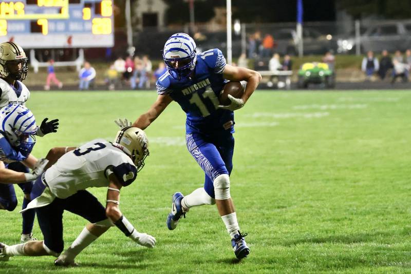 Princeton's Noah LaPorte stiff arms his way into the end zone in Friday's 57-20 win over Mercer County at Bryant Field.