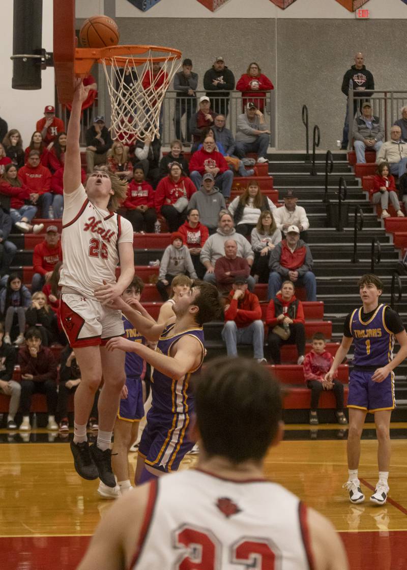 Wyatt West makes a layup against the Mendota Trojans during the IHSA 2A Regional Semifinal at Hall High School on February 19, 2024.