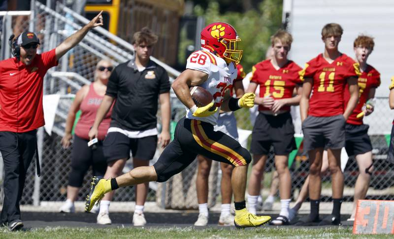 Batavia's Nathan Whitwell (28) breaks down the sideline for a touchdown Saturday, Aug. 31, 2024 at Duchon Field in Glen Ellyn.