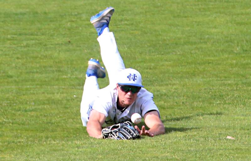 Newman's Brendan Tunink dives and misses a catch in center field during the Class 2A semifinal game on Friday, May 31, 2024 at Dozer Park in Peoria.